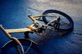 Yellow bike chained to a post with a stolen wheel. bike without a stolen seat Royalty Free Stock Photo