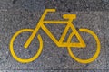 Yellow bike lane sign on road tile Royalty Free Stock Photo