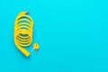Yellow bike lock with keys over turquoise blue background Royalty Free Stock Photo