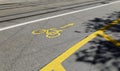 Yellow bike path symbol on concrete road, without traffic during the day sunshine without people, this means of transportation is Royalty Free Stock Photo