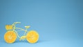 Yellow bike with sliced orange wheels, healthy lifestyle concept with blue pastel background copy space Royalty Free Stock Photo