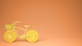 Yellow bike with sliced orange wheels, healthy lifestyle concept with orange pastel background copy space Royalty Free Stock Photo