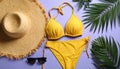 Flat lay composition with yellow swimsuit, hat and sunglasses on purple background Royalty Free Stock Photo
