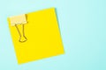 Yellow binder clips and yellow sticky notes. Royalty Free Stock Photo