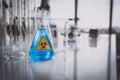 Yellow Biohazzard sign on Chemical Glassware in Lab Royalty Free Stock Photo