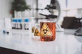Yellow Biohazzard sign on Chemical Glassware in Lab Royalty Free Stock Photo