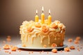 Yellow birthday cake with a candle on the festive table