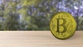 Yellow bitcoin gold coin on wood wooden table over forest trees blur. bit-coin 3d render isolated, cryptocurrency, crypto,