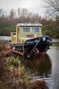 A yellow black boat in the water