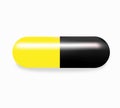 Yellow and black capsules medicine Royalty Free Stock Photo