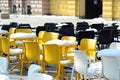 Yellow and black chairs covered in snow Royalty Free Stock Photo