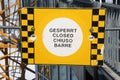 Yellow and black chequered Closed sign in four languages, Zugspitze.