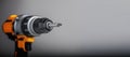 Yellow-black cordless Combi Drill on gray background Royalty Free Stock Photo