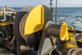 The deck of the ferry boat along with the a thick mooring rope and blue sea water wave, Thailand. Close up Royalty Free Stock Photo