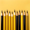 yellow and black pencils on a yellow background. Minimal style. Conceptual minimalist black art. Matte surface. Office supplies