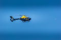 Yellow and Black Police Helicopter flying in sky