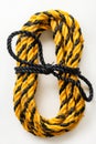 A yellow and black rope with a knot on it. Generative AI Royalty Free Stock Photo