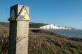 Sign warning of the danger of erosion at the cliff edge overlooking Seven Sisters at Seaford in East Sussex, south coast of UK Royalty Free Stock Photo