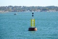 Yellow and black south cardinal buoy