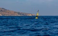 Yellow and black steel navigational floating buoy Royalty Free Stock Photo