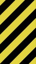 Yellow and black striped caution background in diagonal pattern Royalty Free Stock Photo