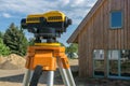 Theodolite on tripod on yard