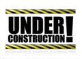 Yellow and black under construction sign