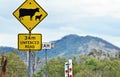 Warning road sign cattle sheep crossing in rural countryside