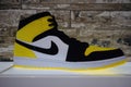 A yellow, black and white Nike Basketball shoe