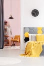 Yellow bedroom interior with clock Royalty Free Stock Photo