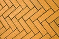 Yellow block pavior driveway. Seamless texture of street tiles. Pattern of yellow sidewalk tiles. Paved path pattern Royalty Free Stock Photo