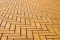 Yellow block pavior driveway. Seamless texture of street tiles. Pattern of yellow sidewalk tiles. Paved path pattern Royalty Free Stock Photo