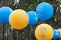 Yellow and blue balloons during the Madrid Pride Parade, translation: they are our children