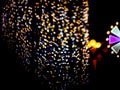 Yellow blue blur heart shape love night light on tree in garden Royalty Free Stock Photo