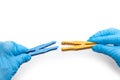 yellow and blue clothespin being attached Royalty Free Stock Photo