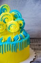 Yellow and blue cream cheese cake with merengues Royalty Free Stock Photo