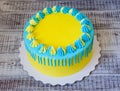 Yellow and blue cream cheese color drip cake with merengues Royalty Free Stock Photo