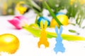 Yellow and blue easter bunny in the snow Royalty Free Stock Photo