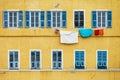 Yellow and blue facade with laundry in Bastia Corsica