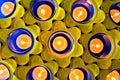 Yellow and blue flower tealight candle holders. Pretty background pattern image