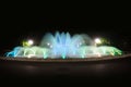 Yellow, blue, and green water fountain at night Royalty Free Stock Photo