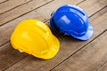 yellow, blue hard safety helmet construction hat for safety project of workman as engineer or worker Royalty Free Stock Photo