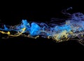 Yellow and blue ink in water Royalty Free Stock Photo