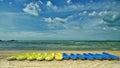 Yellow and blue kayaks on a typical beach