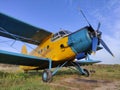 Yellow and blue old biplane plane with a single piston engine and propeller Royalty Free Stock Photo