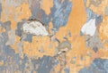 Yellow and blue paint peeling off wall background Royalty Free Stock Photo