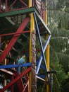 Yellow and blue parrot on a colorful wooden structure in the amazon jungle of colombia Royalty Free Stock Photo