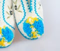Yellow-blue pumpon on a Greek slipper