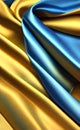 Yellow and blue silk fabric background. Close up of ripples in golden silk fabric. A gold and blue silk texture. Royalty Free Stock Photo