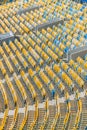 Yellow and blue stadium seats and stadium stairs Royalty Free Stock Photo